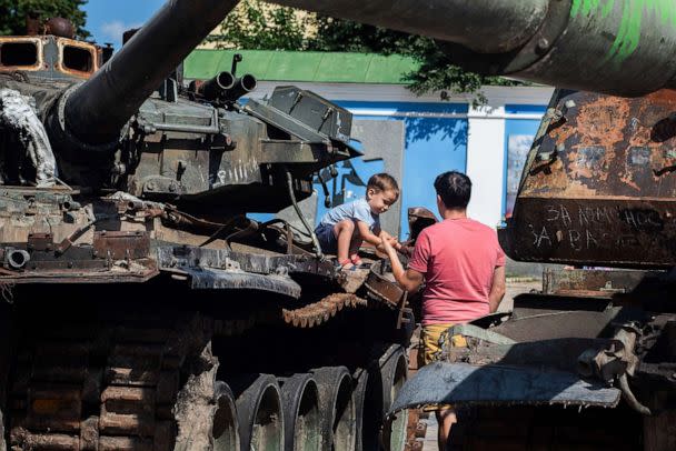 PHOTO: A boy plays on top of a Russian tank destroyed by Ukrainian forces in the center of Kyiv, Ukraine, Sept. 2, 2022. (Ximena Borrazas/SOPA Images via ZUMA Press Wire)