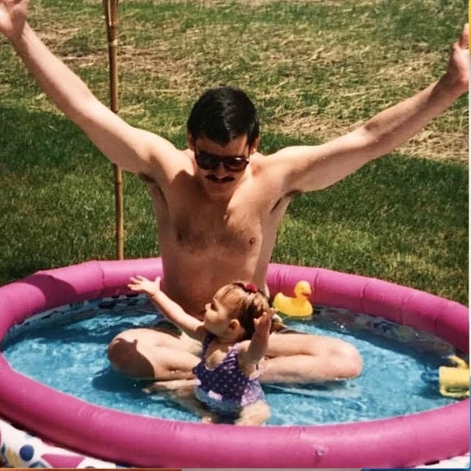 Ed Daizovi in the '90s with his 18-month-old daughter, Cecilia, who he was able to spend extra time with during the paternity leave he took when Cecilia's younger sister was born.