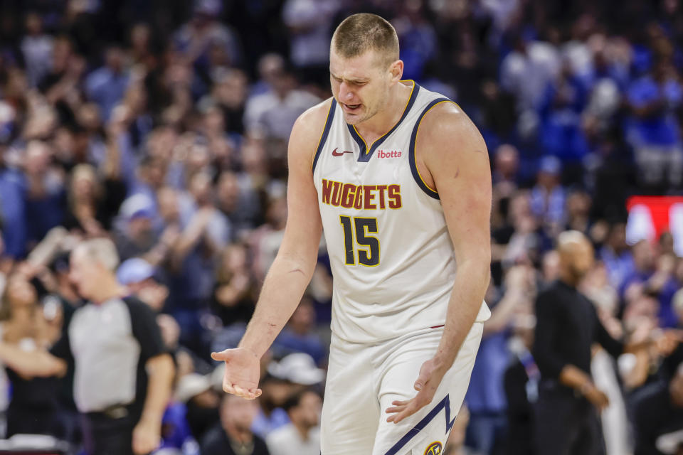 Denver Nuggets center Nikola Jokic reacts during the second half of the team's NBA basketball game against the Orlando Magic, Wednesday, Nov. 22, 2023, in Orlando, Fla. (AP Photo/Kevin Kolczynski)