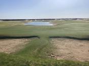 This Sept. 27, 2021 photo shows The Lido Golf Club under construction at Sand Valley Golf Resort in Nekoosa, Wis. The course was designed through old photos and documents, with the help of a course-building video game. The Lido will be an exact restoration of an abandoned course of the same name on Long Island, long considered one of the best golf courses in the world. (AP Photo/John Marshall)