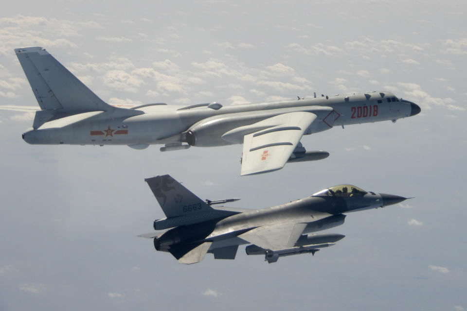 FILE - In this Feb. 10, 2020, file photo and released by the Republic of China (ROC) Ministry of National Defense, a Taiwanese Air Force F-16 in foreground flies on the flank of a Chinese People's Liberation Army Air Force (PLAAF) H-6 bomber as it passes near Taiwan. This year's annual congress meeting comes as China and the U.S. are attempting to soften the caustic tone in relations that prevailed during the Trump administration. While President Joe Biden is maintaining pressure over trade and technology, he has shown a willingness to restore dialogue. However, China has not shown any willingness to budge in the face of U.S. support for Taiwan and criticism of Beijing's policies in Hong Kong, Tibet and Xinjiang. (Republic of China (ROC) Ministry of National Defense via AP, File)