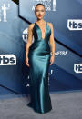 The "Marriage Story" and "Jojo Rabbit" star wowed photographers with her plunging teal gown by Armani Privé.