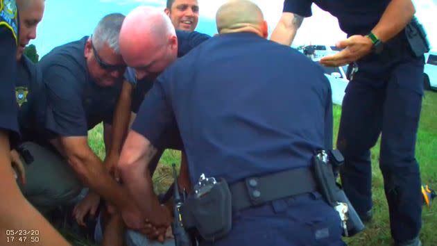 In this Saturday, May 23, 2020, image from Franklin Parish Sheriff's Office body camera video, law enforcement officers restrain Black motorist Antonio Harris on the side of a road after a high-speed chase in Franklin Parish, Louisiana.  (Photo: Aaron Touchet/Franklin Parish Sheriff's Office via AP, File)