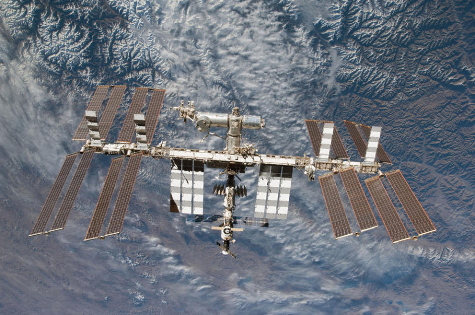 Backdropped by Earth, the International Space Station is seen in this image photographed by an STS-130 crew member on space shuttle Endeavour after the station and shuttle began their post-undocking relative separation, in this undated NASA handout photo. The shutdown idled most of NASA's 18,000 workers. Only 550 employees were considered exempt, including two American astronauts serving aboard the International Space Station and flight directors at Mission Control in Houston. Skeleton staff maintain key science and communications satellites but work on new missions, including preparations to launch a Mars probe on Nov. 18, have been suspended, said NASA. REUTERS/NASA/Handout via Reuters (UNITED STATES - Tags: SCIENCE TECHNOLOGY POLITICS BUSINESS) ATTENTION EDITORS - THIS IMAGE WAS PROVIDED BY A THIRD PARTY. FOR EDITORIAL USE ONLY. NOT FOR SALE FOR MARKETING OR ADVERTISING CAMPAIGNS. THIS PICTURE IS DISTRIBUTED EXACTLY AS RECEIVED BY REUTERS, AS A SERVICE TO CLIENTS