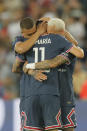 PSG's Angel Di Maria, (11), celebrates after scoring his sides 5th goal with teammates PSG's Kylian Mbappe, left ,and PSG's Neymar during the French League One soccer match between Paris Saint Germain and Metz at the Parc des Princes stadium in Paris, France, Saturday, May 21, 2022. (AP Photo/Michel Spingler)