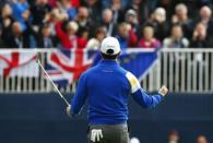 European Ryder Cup player Rory McIlroy celebrates winning the sixth hole during the 40th Ryder Cup singles matches at Gleneagles in Scotland September 28, 2014. REUTERS/Eddie Keogh