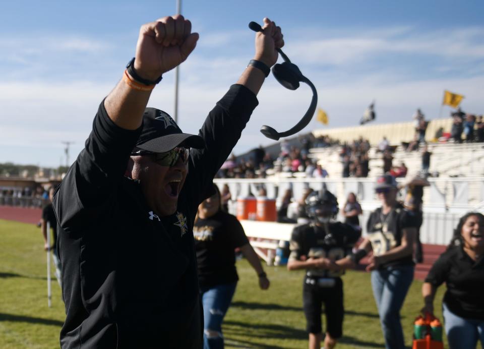 Plains' head football coach Mike Martinez celebrates the team's win against Smyer in a District 4-2A Division II football game, Thursday, Nov. 3, 2022, at Cowboy Stadium in Plains. Plains won, 37-36, and will continue to the playoffs.