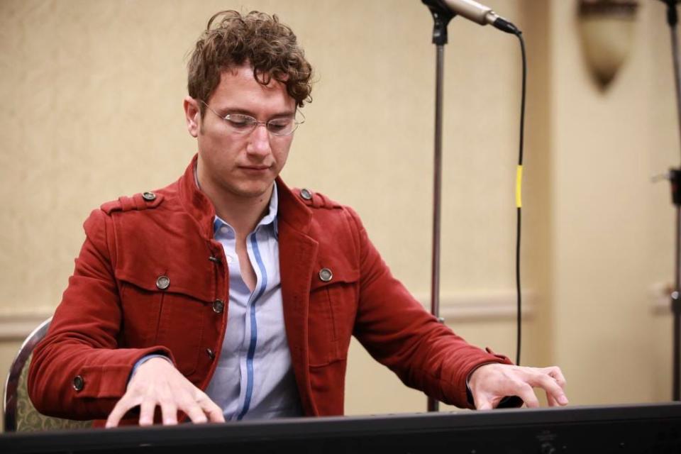 Louisville Orchestra director Teddy Abrams performs during the breakfast portion of the annual Wayside Christian Mission Thanksgiving event at the Hotel Louisville. Nov. 27, 2014