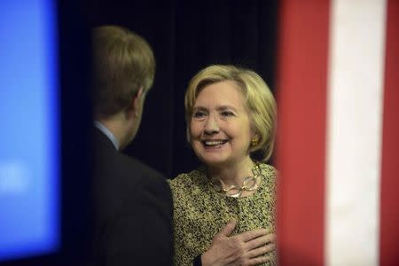 Democratic U.S. presidential candidate Hillary Clinton meets with a supporter backstage after a campaign event at Carnegie Mellon University in Pittsburgh, Pennsylvania April 6, 2016. REUTERS/Alan Freed