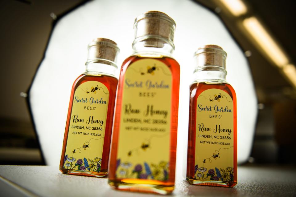 Bottles of raw honey from Secret Garden Bees honey farm in Linden.