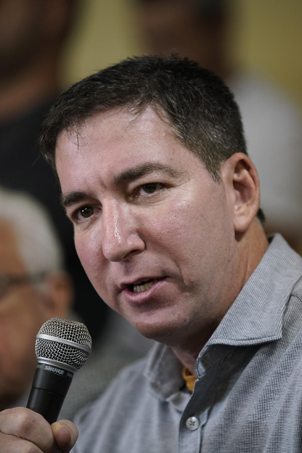 Journalist Glenn Greenwald speaks during a press conference before the start of a protest in his support in front of the headquarters of the Brazilian Press Association, known as ABI, in the city of Rio de Janeiro, Brazil, Tuesday, July 30 , 2019. Brazil's president has raised the possibility of jail for Greenwald a few days after members of his party said the American's Brazil-based internet publication was "aligned with criminal hackers" for reporting on hacked phone calls. (AP Photo/Ricardo Borges)