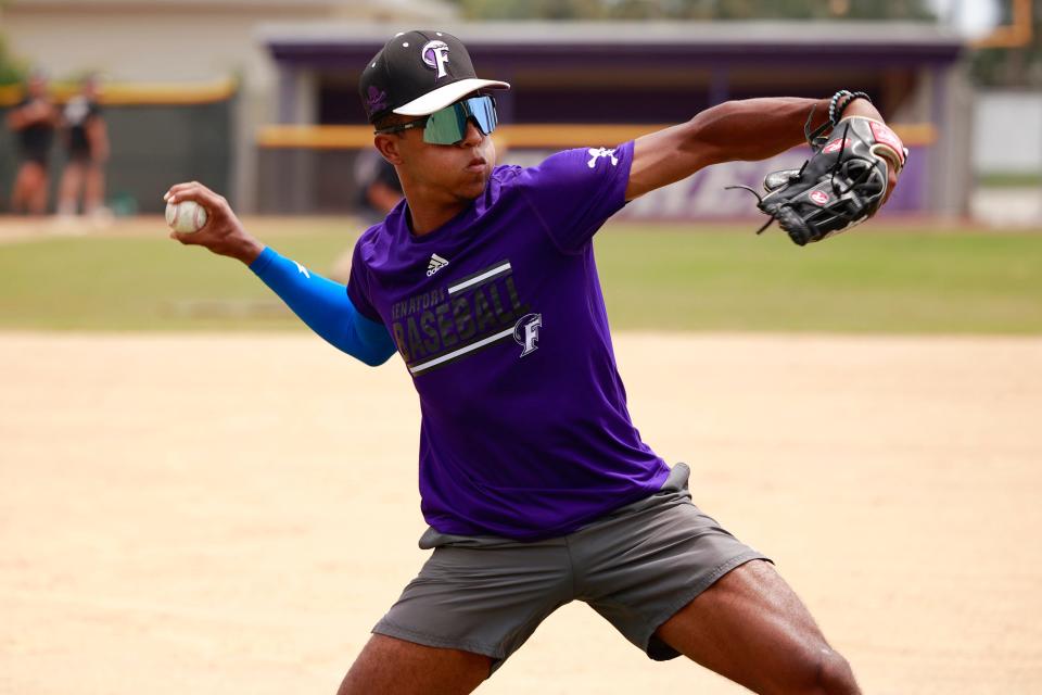 Kyson Witherspoon throws the ball in Fletcher baseball practice in April.