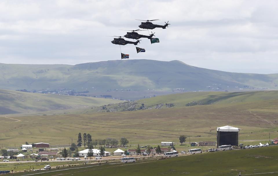 South African army helicopters fly over the grave of late President Nelson Mandela at the graveyard within the Mandela family's property in the village of Qunu