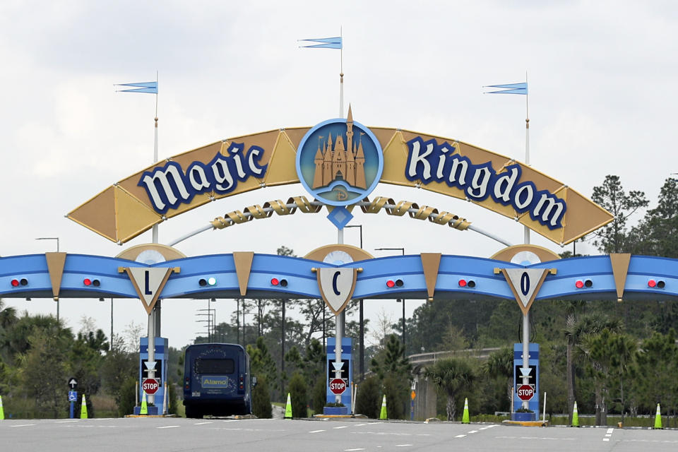 FILE - In this March 16, 2020, file photo, the entrance to the parking lot at the Magic Kingdom at Walt Disney World is closed in Lake Buena Vista, Fla. The Splash Mountain ride at Disney parks in California and Florida is being recast. Disney officials said the ride would no longer be tied to the 1946 movie, "Song of the South," which many view as racist. Instead, the revamped ride will be inspired by the 2009 Disney film, "The Princess and the Frog," which has an African-American female lead. (AP Photo/John Raoux, File)