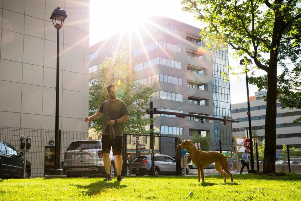 Dennis Shipley, of Lexington, Ky., plays with his dog, Chloe, at the new dog park at Phoenix Park in downtown Lexington, Ky., Tuesday, April 25, 2017. Shipley lives downtown and uses the park because of the close proximity to his home.