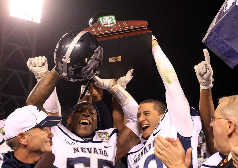 SAN FRANCISCO, CA - JANUARY 09: Dontay Moch #55 and Colin Kaepernick #10 of the Nevada Wolf Pack hold up the trophy after they beat Boston College in the Kraft Fight Hunger Bowl at AT&T Park on January 9, 2011 in San Francisco, California. (Photo by Ezra Shaw/Getty Images)