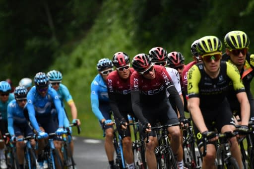 Chris Froome (3rdR) with his Ineos band at the Dauphine on Sunday