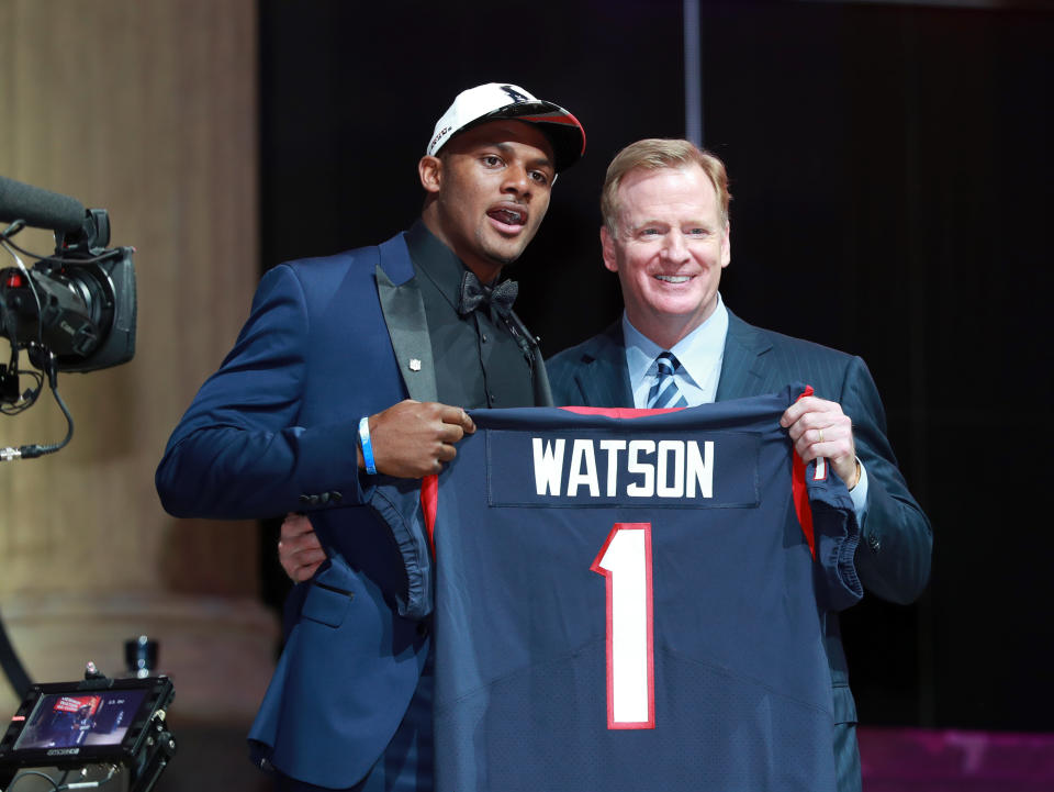 Deshaun Watson posed with Roger Goodell at last year's draft wearing a brand new draft-day hat. (AP)