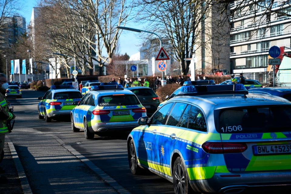 Police vehicles are parked on the grounds of Heidelberg University (AP)