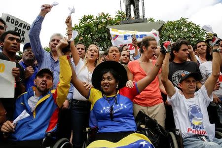 Opposition supporters in wheelchairs arrive from the state of Lara to a gathering with Lilian Tintori, wife of jailed Venezuelan opposition leader Leopoldo Lopez, and to take part in a rally on September 1, in Caracas, Venezuela August 31, 2016. REUTERS/Marco Bello