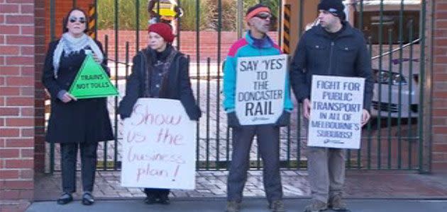 East West Link protesters gather at construction giant John Holland's office buildings at Abbotsford. Photo: 7News