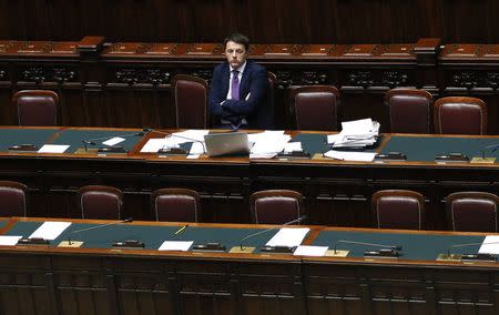 Italy's Prime Minister Matteo Renzi sits during a confidence vote at the lower house of the parliament in Rome in this February 25, 2014 file photo. REUTERS/Giampiero Sposito/Files