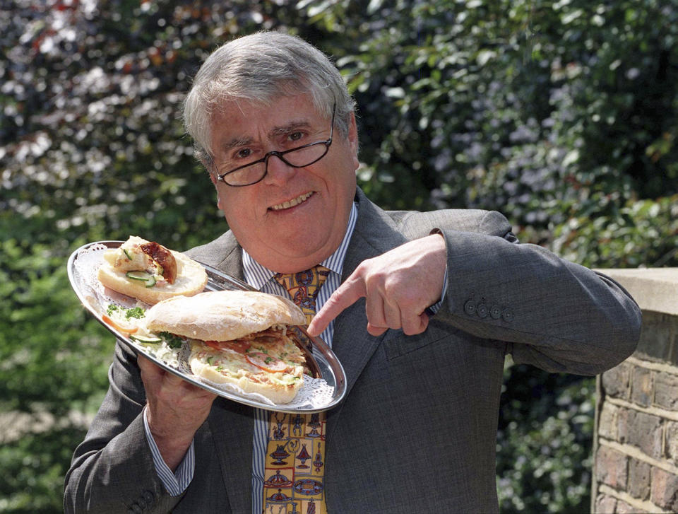 FILE - In this May 16, 1997 file photo, Albert Roux poses for a photo. Roux, the French-born chef and restaurateur who along with his late brother Michel had a profound influence on British dining habits, has died. He was 85, it was reported on Wednesday, Jan. 6, 2021. The brothers are widely credited with revolutionizing Britain’s staid and old-fashioned culinary scene, notably with their opening of Le Gavroche in London in 1967, a restaurant that was frequented by a loyal clientele that included many of the icons of the Swinging Sixties in London. (PA via AP, File)