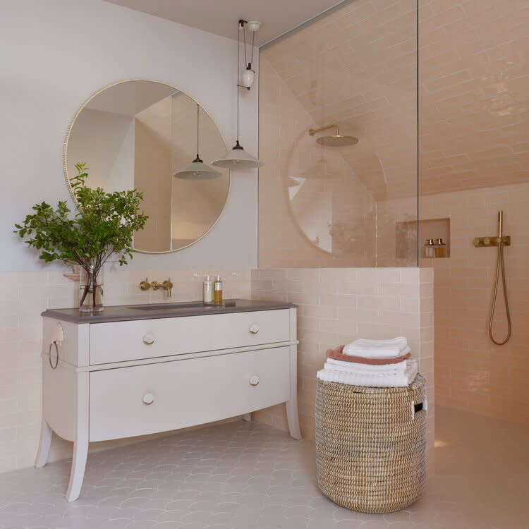 Pastel pink bathroom with walk in shower