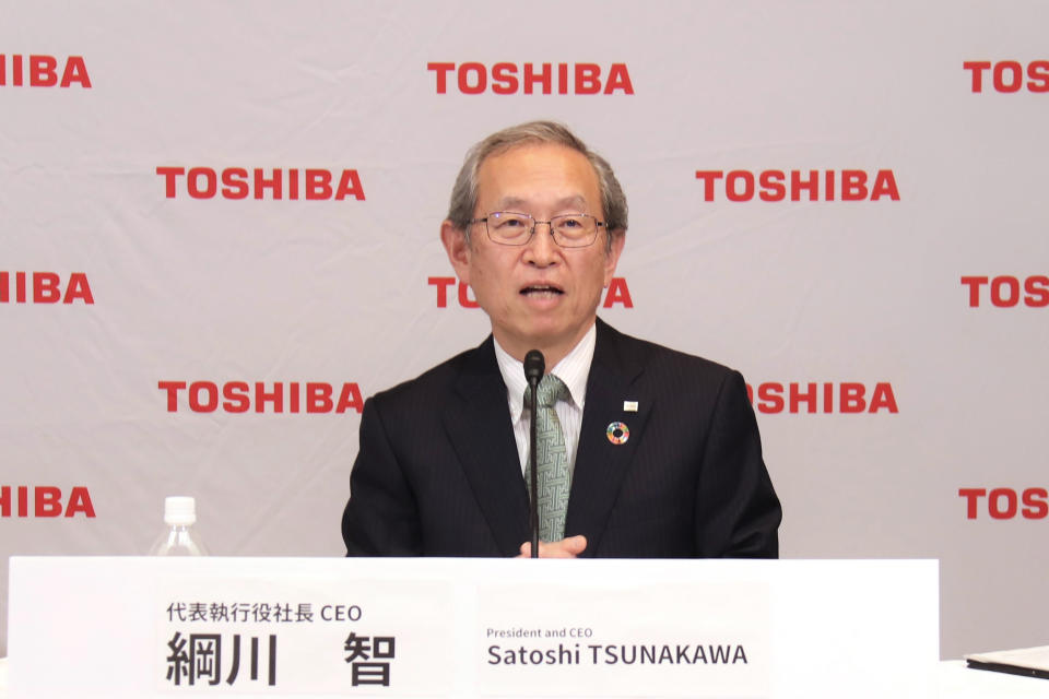 In this image provided by Toshiba Corporation, new Toshiba President Satoshi Tsunakawa speaks during an online press conference in Tokyo, Wednesday, April 14, 2021. Nobuaki Kurumatani, the president of Toshiba Corp. stepped down Wednesday, a week after the Japanese technology and manufacturing giant said it was studying an acquisition proposal from a global fund where he previously worked. Kurumatani will be replaced by his predecessor, Tsunakawa. (Toshiba Corporation via AP)