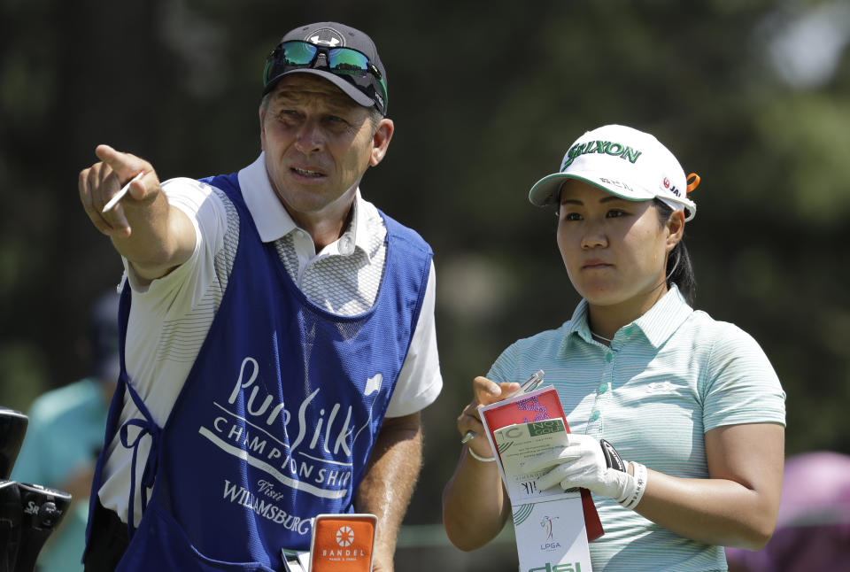 Nasa Hataoka, of Japan, right, listens to her caddie on the second tee during the final round of the Pure Silk Championship golf tournament at Kingsmill Resort, in Williamsburg, Va., Sunday, May 26, 2019. (AP Photo/Steve Helber)