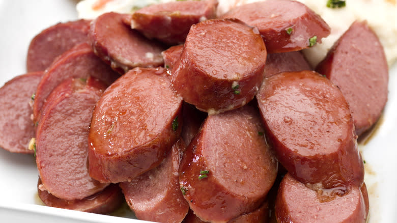 Plate of sliced smoked sausages