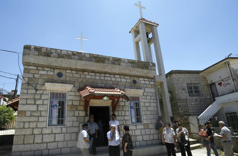 Worshippers attend mass at a church in the village of Ein Qiniye in the Israeli-occupied Golan Heights on June 11, 2017