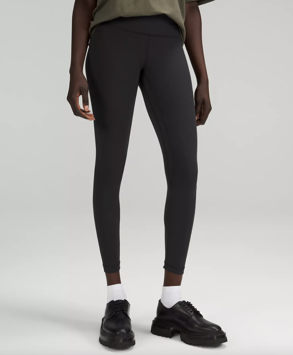 model wearing black shoes, white socks and leggings, Lululemon Align High-Rise Pant in black (photo via Lululemon)