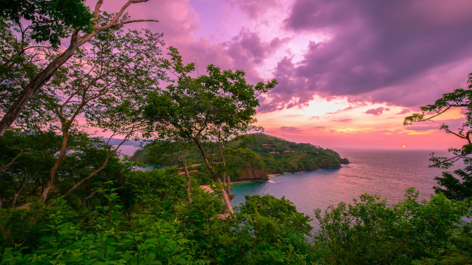 A shot of beautiful sunset over Coast Rica coastline.