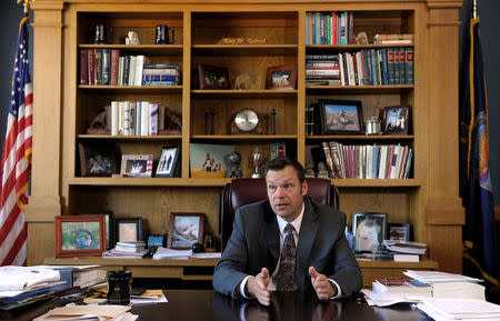 Kansas Secretary of State Kris Kobach talks about the Kansas voter ID law that he pushed to combat what he believes to be rampant voter fraud in the United States in his Topeka, Kansas, U.S., office May 12, 2016. REUTERS/Dave Kaup