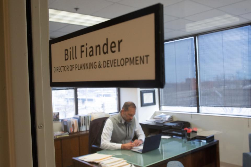 Bill Fiander, who recently retired from his job as director of planning and development for Topeka's city government, works this past week in his office at the city's Holliday Building.