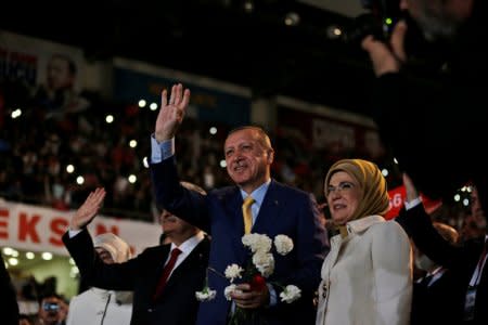 Turkish President Tayyip Erdogan, accompanied by his wife Emine Erdogan, greets members of his party during the Extraordinary Congress of the ruling AK Party (AKP) in Ankara, Turkey, May 21, 2017. REUTERS/Burhan Ozbilici/Pool