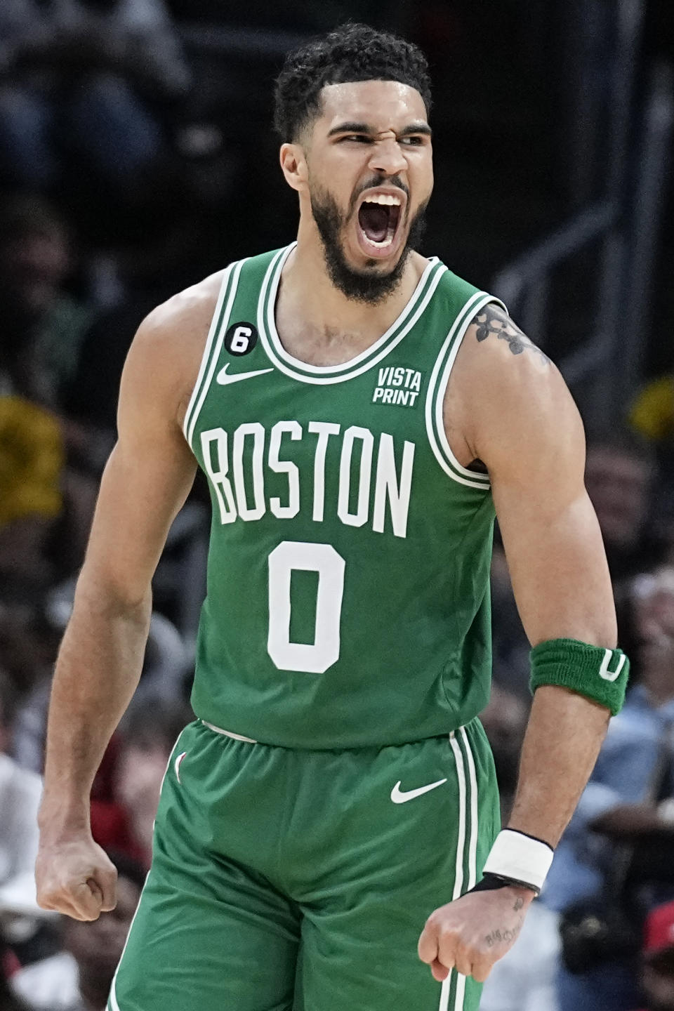 Boston Celtics forward Jayson Tatum (0) celebrates after scoring against the Atlanta Hawks during the second half of Game 4 of a first-round NBA basketball playoff series, Sunday, April 23, 2023, in Atlanta. (AP Photo/Brynn Anderson)