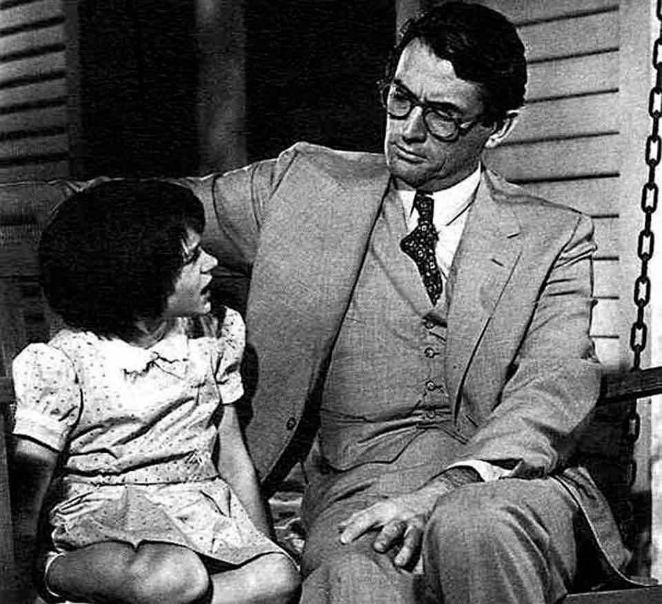 Mary Badham as Scout and Gregory Peck as Atticus Finch in To Kill a Mockingbird.