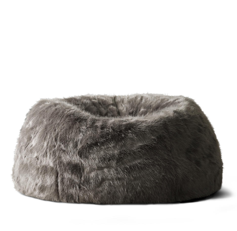 This undated photo provided by RH, Restoration Hardware, shows a squooshy, faux fur bean bag chair. The chair satisfies several of the hygge trend's characteristics, including comfort, warmth and softness. (RH, Restoration Hardware via AP)