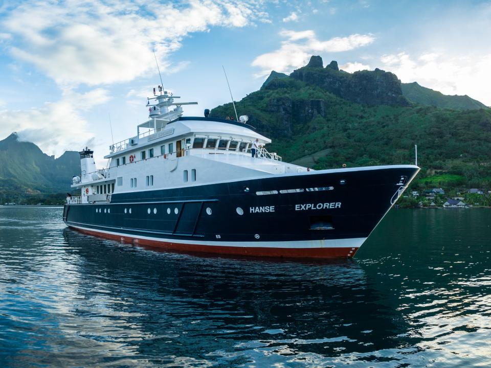 The Hanse Explorer near greenery on land