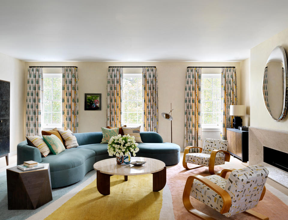 A curved sofa in an elegant sitting room