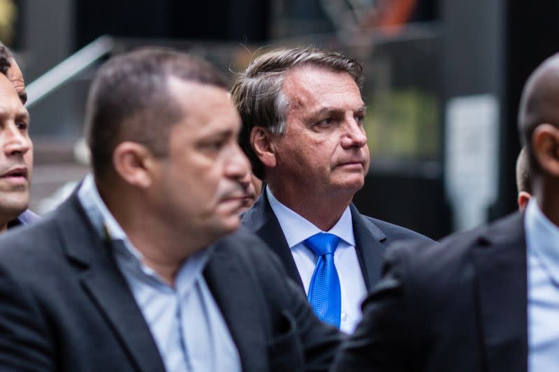 Brazil's President Jair Bolsonaro walks outside his hotel in New York