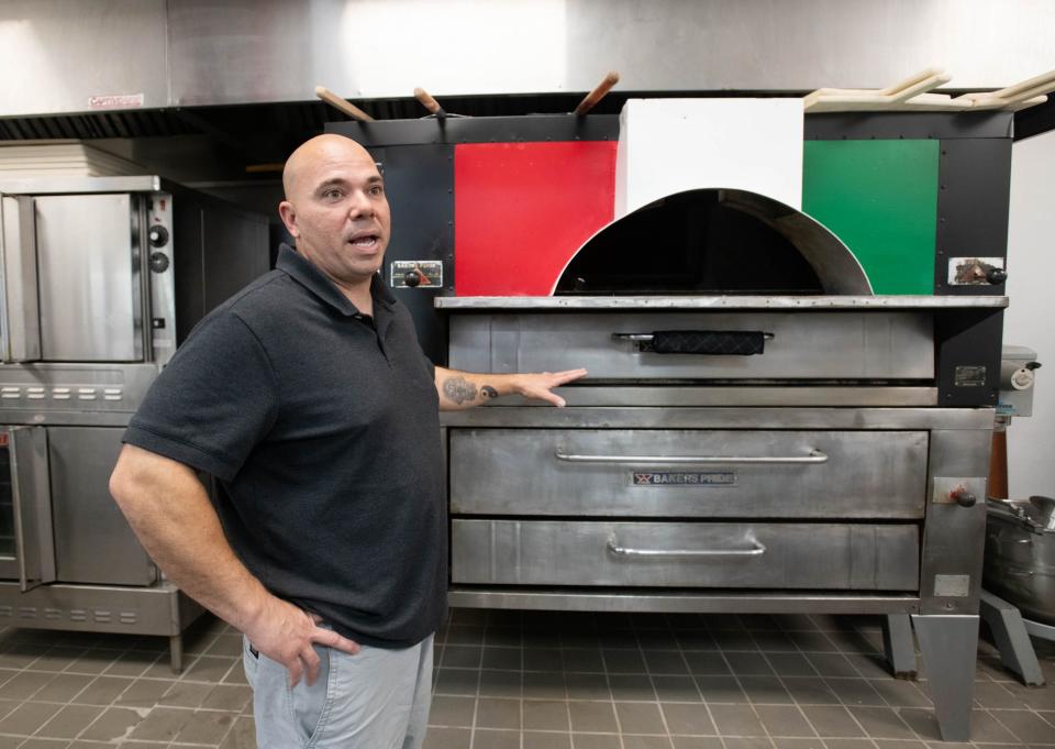 Owner Boaz Benzakry talks about his pizza oven while giving a tour of Seneca's Italian Deli & Market at 3707 Gulf Breeze Parkway on Friday, March 15, 2024. The business will be opening soon.