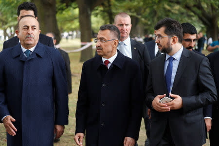 Turkey's Foreign Minister Mevlut Cavusoglu (L) walks in Christchurch, New Zealand March 18, 2019. REUTERS/Jorge Silva