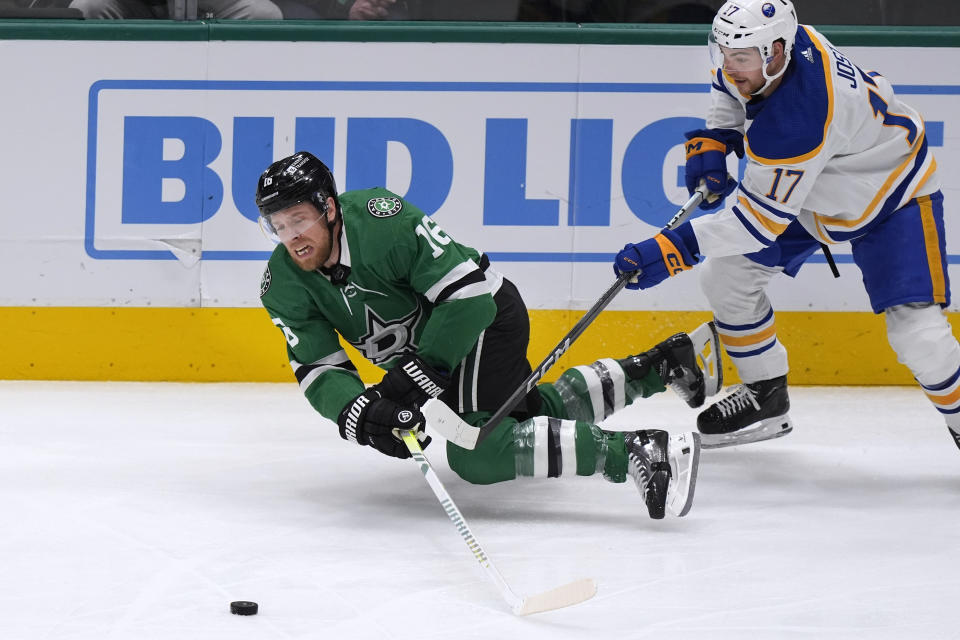 Dallas Stars center Joe Pavelski (16) reaches for the puck next to Buffalo Sabres center Tyson Jost (17) during the first period of an NHL hockey game in Dallas, Tuesday, April 9, 2024. (AP Photo/LM Otero)