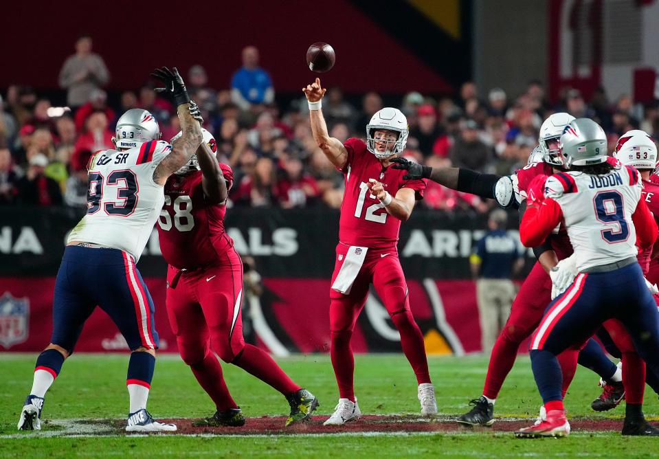 December 12, 2022; Glendale, Ariz; USA; Cardinals quarterback Colt McCoy (12) throws a pass against the Patriots during the first half of a game at State Farm Stadium. 