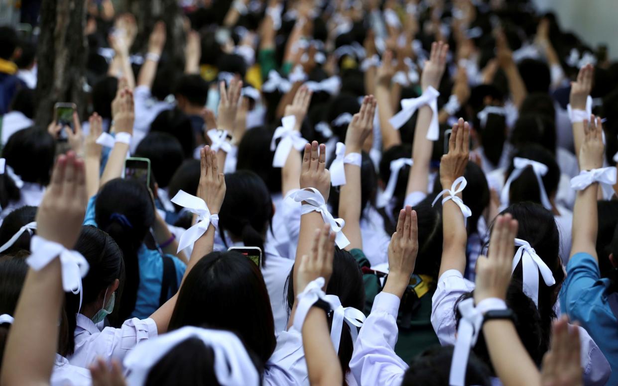 Students show support for the student-led democracy movement outside the Education Ministry in Bangkok - REUTERS