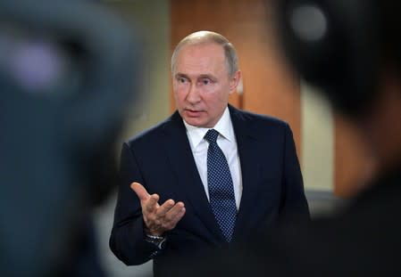 Russia's President Putin meets with journalists in Yekaterinburg