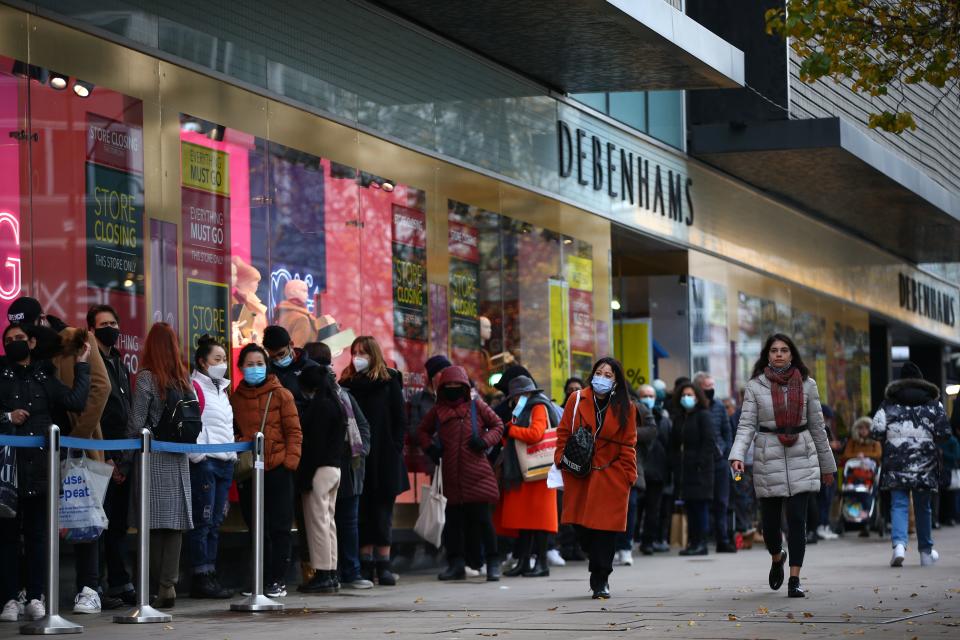 Shoppers queue outside Debenhams on Oxford Street in London last week as the store collapsed, triggering a fire sale. Photo: Hollie Adams/AFP/Getty